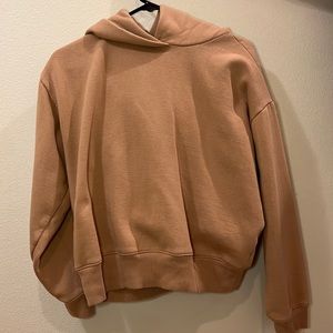 Tan oversized cropped hoodie.